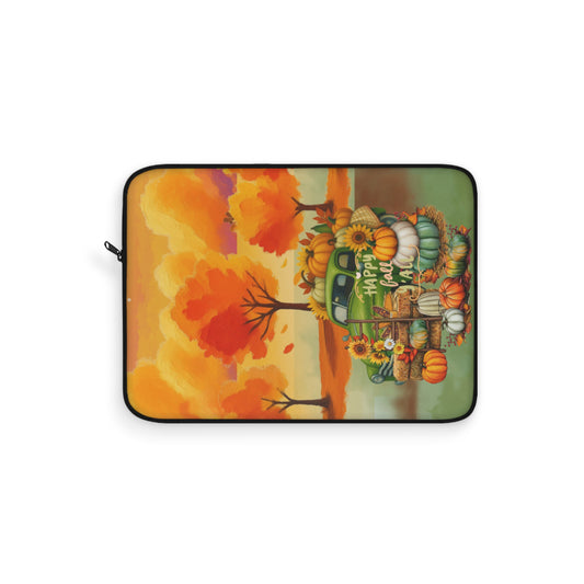 A laptop sleeve featuring a colorful autumn-themed illustration with a green truck loaded with pumpkins, sunflowers, and fall foliage, set against a plain white background.