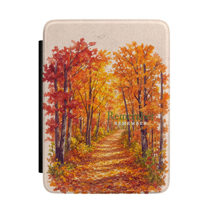 A tablet case featuring a printed autumn forest scene with a path through orange and red trees, shown on a plain white background.