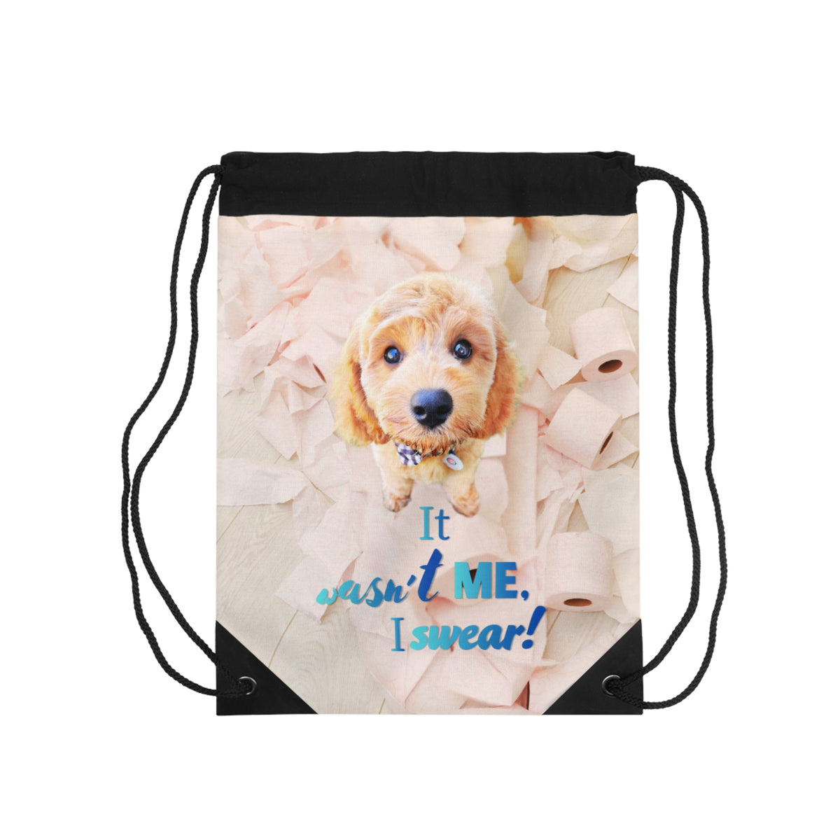 A black drawstring backpack featuring a printed graphic of a cute golden-brown puppy surrounded by torn toilet paper, with the text 'It wasn't ME, I swear!' in blue and white lettering.
