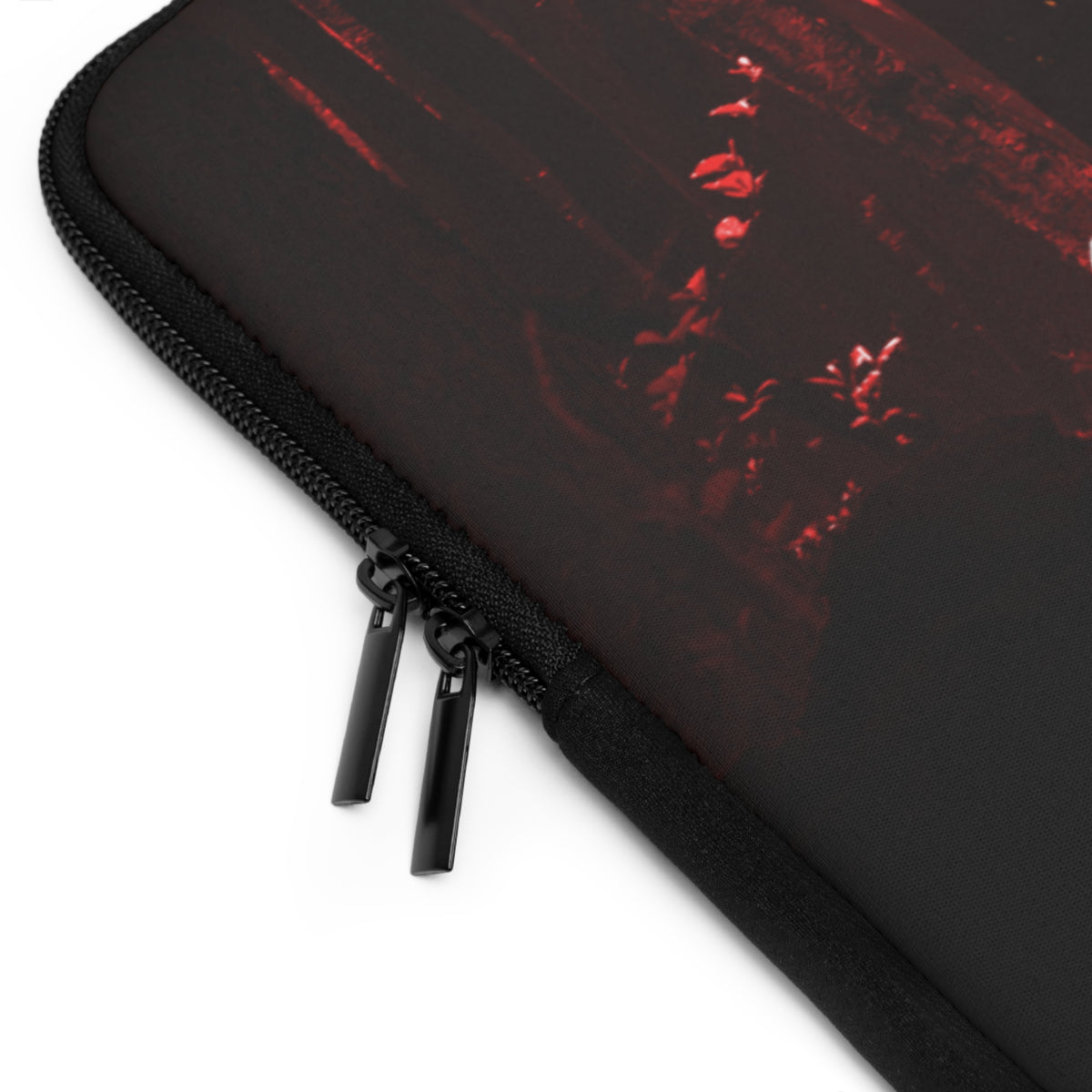 Close-up of a black zippered sleeve or case with a distressed red graphic print, shown on a white background.