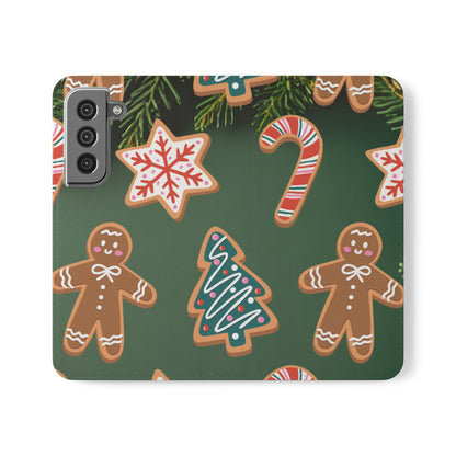 A phone case featuring a festive Christmas pattern with gingerbread men, trees, candy canes, and snowflakes on a dark green background.