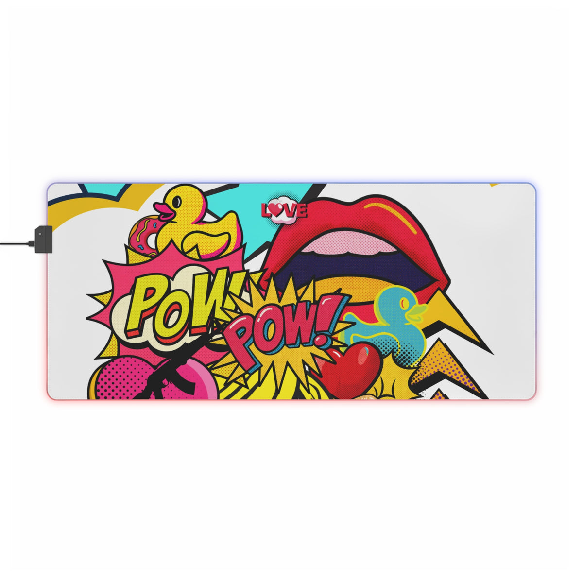 A rectangular gaming mouse pad with a colorful pop-art comic design, featuring a rubber duck, red lips, and 'POW! POW!' text, shown on a white background with a power cable extending from the left.
