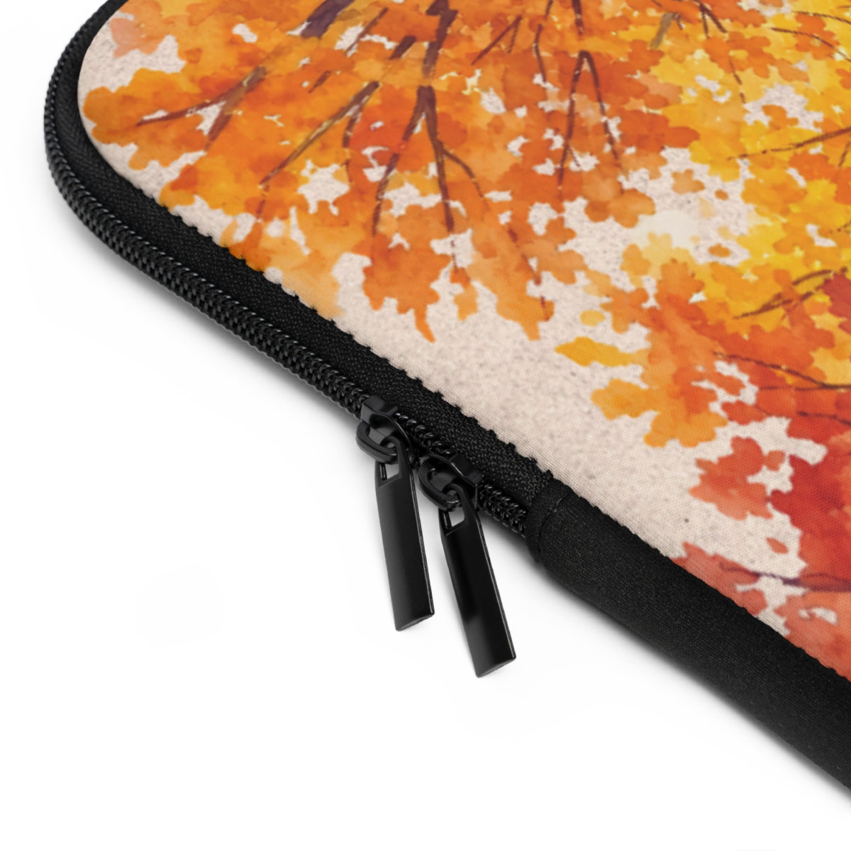 Close-up of a zippered sleeve with a watercolor autumn leaf pattern in orange, yellow, and red on a white background.