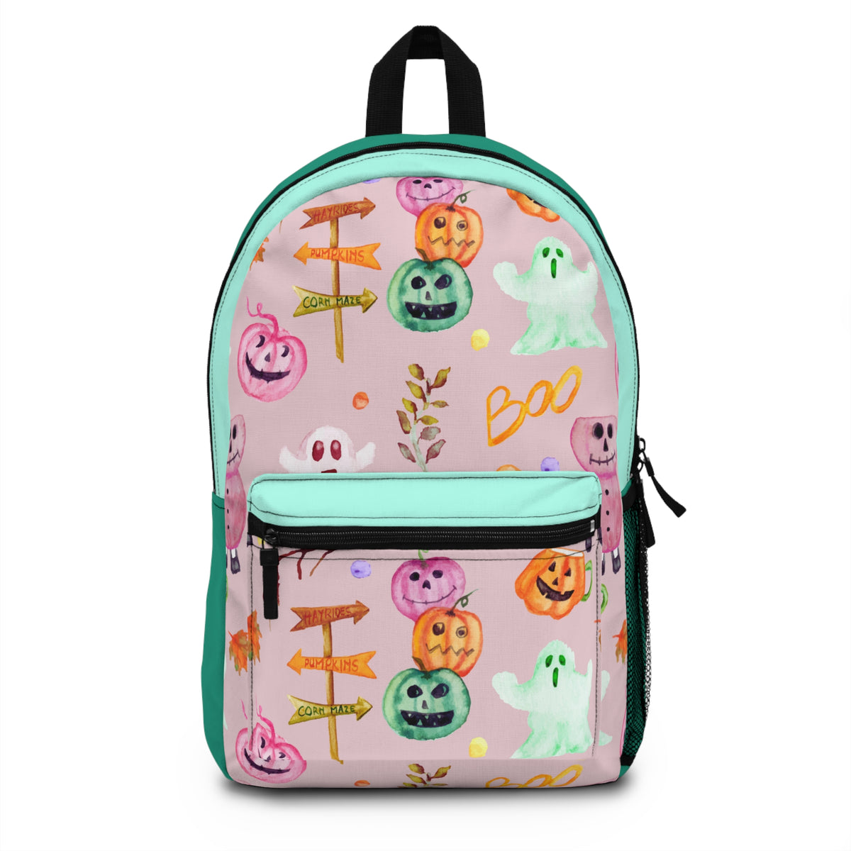 A pink backpack with a Halloween-themed print featuring cartoon pumpkins, ghosts, directional signs, and the word 'Boo' in orange, green, white, and yellow. The backpack has mint green piping, a black top handle, and a front zippered pocket.