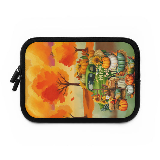 A rectangular zippered pouch with a black zipper and trim, featuring a colorful autumn-themed print of a green vintage truck loaded with pumpkins, sunflowers, and fall leaves against a warm orange sky.