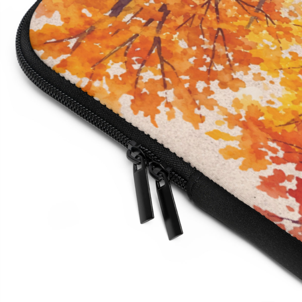 Close-up of a zippered sleeve with a watercolor autumn leaf pattern in orange, yellow, and red on a cream background, featuring black zippers and pull tabs.