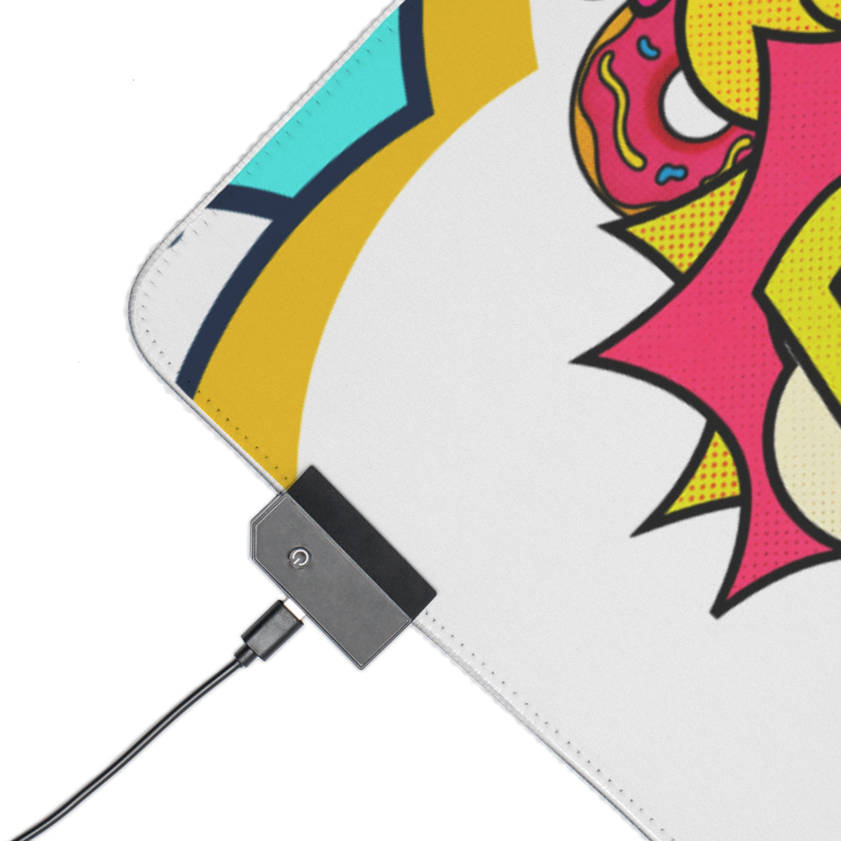 A close-up of a white mouse pad with a colorful comic-style graphic and a black USB charging dock attached, shown on a white background.