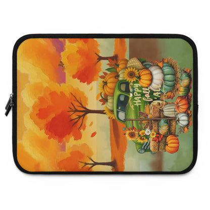 A laptop sleeve featuring a colorful autumn-themed illustration with a green pickup truck loaded with pumpkins, corn, and sunflowers, set against orange and yellow fall trees. The text 'Happy Fall' is written on the side.
