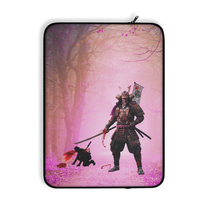 A laptop sleeve featuring a graphic print of a samurai warrior in black and red floating against a pink and purple background with cherry blossom trees.