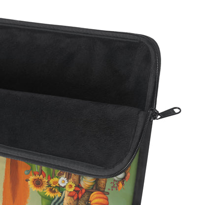 Close-up of an open zippered pouch or sleeve with a black fleece interior and a colorful printed exterior featuring autumn flowers, pumpkins, and a tree on a white background.