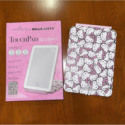 Impressions Vanity Hello Kitty Touch Pad Mini Tri-Tone Makeup Mirror with Printed Flip Cover and LED Strip, Travel Vanity Mirror with Touch Sensor Switch and USB Extension (White/Pink)