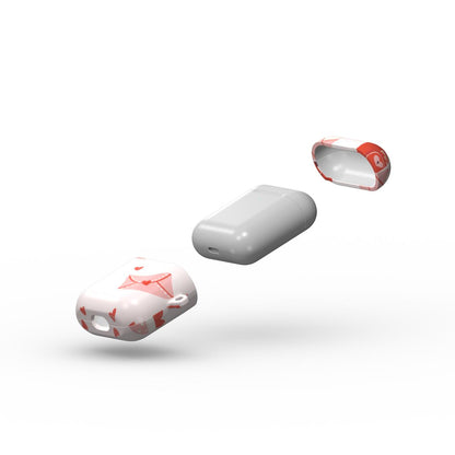 Three floating views of a wireless earbud charging case cover: one solid light gray case in the center, and two white silicone cases with red heart patterns in the foreground and background.