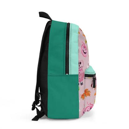 A backpack shown from the side on a white background, featuring a solid teal green body, a mint green vertical stripe, a pink side panel with a cartoon character print, and black straps and zippers.