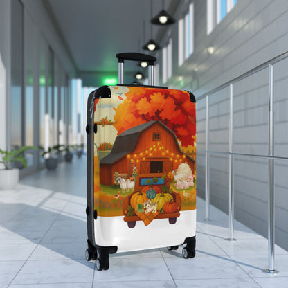 A hard-shell rolling suitcase with a colorful autumn farm illustration printed on the exterior, standing upright in a modern indoor hallway with tiled floors and glass windows.