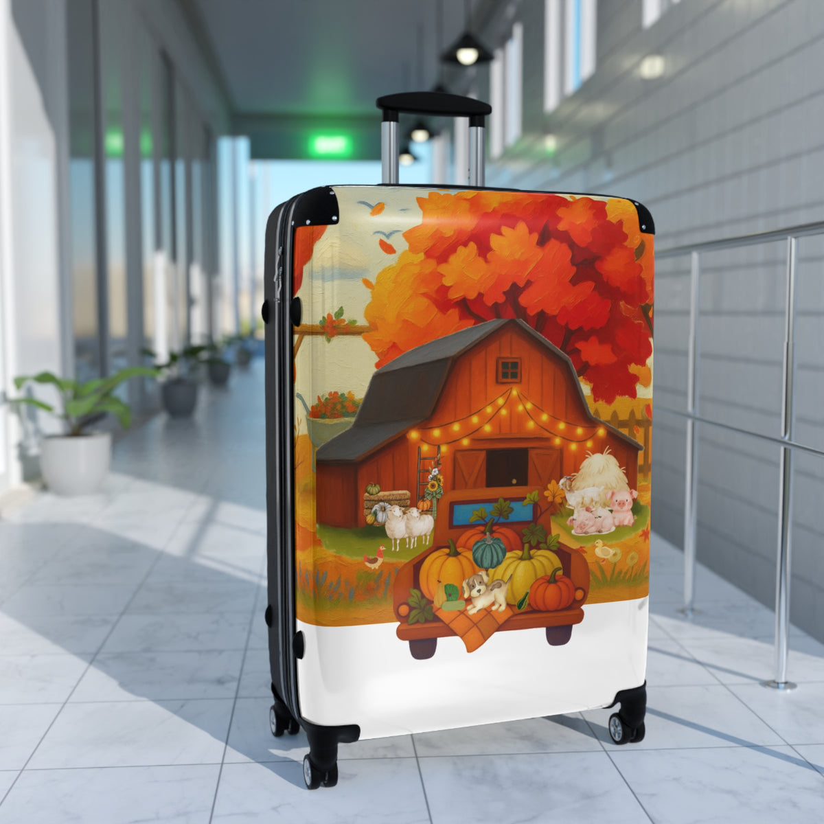 A hard-shell carry-on suitcase with an extended telescoping handle stands in a modern indoor hallway. The suitcase shell is printed with a detailed autumn farm illustration featuring a barn, pumpkins, sheep, and a large orange-red autumn tree.