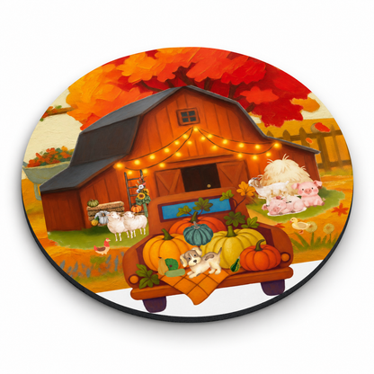 A ROUND MOUSE PAD featuring a colorful autumn farm illustration with a barn, pumpkins, sheep, pigs, a dog, and fall foliage on a white background.