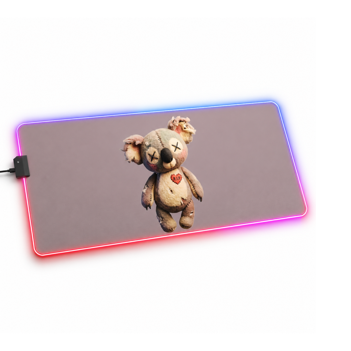 A rectangular gaming mouse pad with rounded corners, featuring a printed graphic of a creepy, stitched beige teddy bear with a red heart on its chest. The mouse pad is illuminated by a glowing LED border that shifts dynamically between blue, purple, and pink, set against a plain white background.