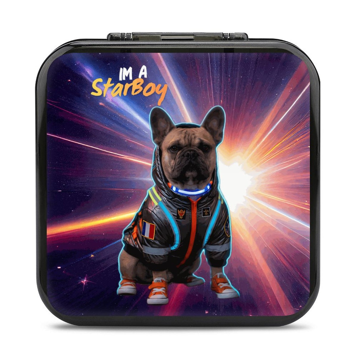 A square GAME CARD CASE with rounded corners, featuring a colorful printed graphic of a French bulldog in a futuristic space-themed jumpsuit with glowing blue and orange accents. The text 'I'M A Starboy' appears at the top of the print.